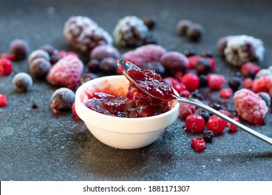 Red Fruits Jam With Berries On A Dark Kitchen Top