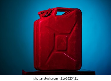 Red Fuel Container On A Blue Background Isolated Closeup With Blank Space For Title And Text