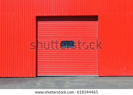Red garage gate with small window on it. Large automatic up. Multicolor background set