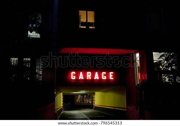 red garage light\
illuminated at night