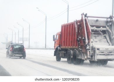 Red Garbage Truck On Winter Road