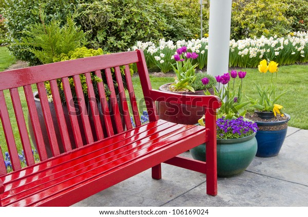 Red Garden Bench On Patio Surrounded Stock Photo Edit Now 106169024