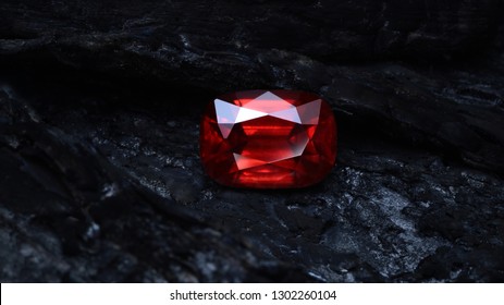 
Red Garnet Rhodolite On Coal Background.