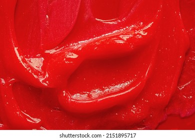 Red Gel Texture. Cosmetic Clear Liquid Cream Smudge. Skin Care Product Sample Closeup. Toothpaste Or Wax Background