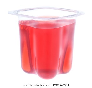 Red Gelatin In A Plastic Yogurt Cup. On A White Background.