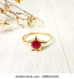 red gem in star shaped ring - Shutterstock ID 2088161341