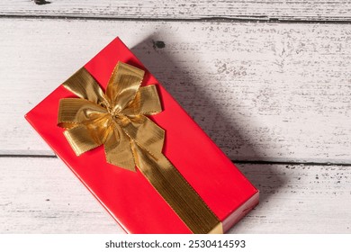 red gift box with golden ribbon isolated on wooden background, gift box on wooden table, top view, time to gift, 
celebration christmas gift box. christmas present,  






 - Powered by Shutterstock