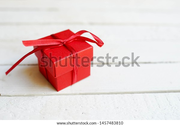 Red Gift Box On White Wooden Stock Photo (Edit Now) 1457483810
