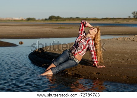 Similar – Young woman on the beach in the sun