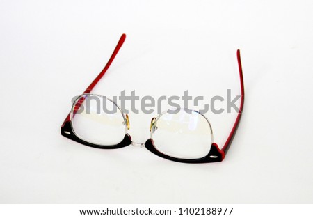 Red glasses frame on a white background "