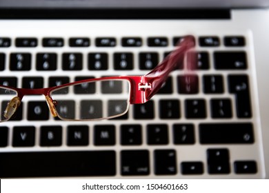 Red glasses and a notebook