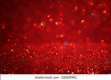 Red Glitter Vintage Lights Background. Defocused.