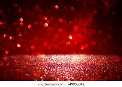 Red Glitter Vintage Lights Background. Defocused