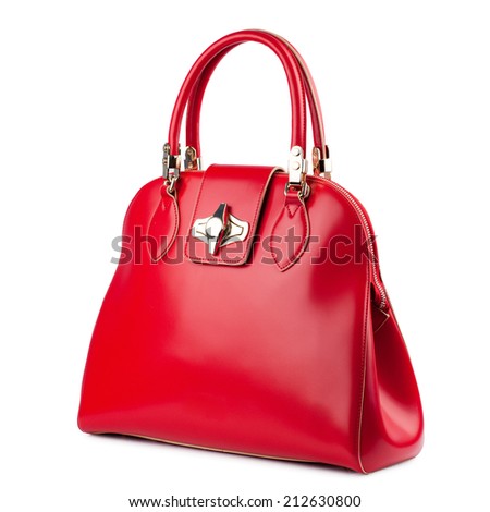 Red glossy female leather bag isolated on white background