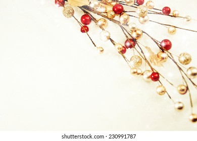 Red And Gold Christmas Baubles On Snow.
