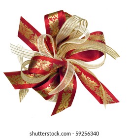 Red and gold Christmas ribbon bow, with holly motif.  Isolated on white.