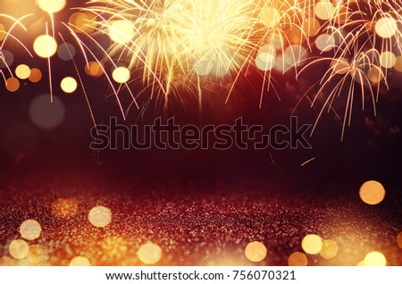 Red and Gold Vintage Fireworks and bokeh in New Year eve and copy space. Abstract background holiday.