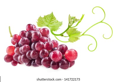 Red grape with green leaves, closeup, isolated on white background