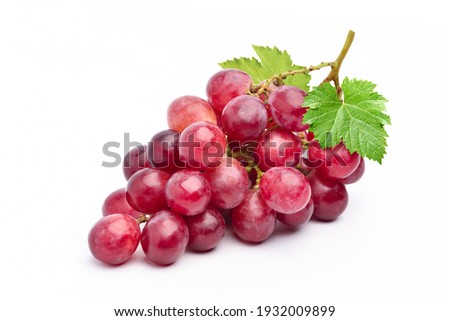 Red grape with leaves isolated on white background.