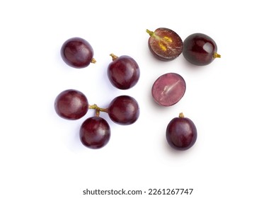 Red grapes and half sliced isolated on white background. Top view. Flat lay. Grape pattern texture background. 