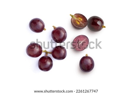 Red grapes and half sliced isolated on white background. Top view. Flat lay. Grape pattern texture background. 