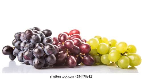 Red, Green And Black Grapes Fruits Over White Background