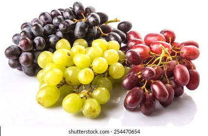 Red, Green And Black Grapes Fruits Over White Background