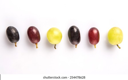 Red, green and black grapes fruits over white background - Shutterstock ID 254478628
