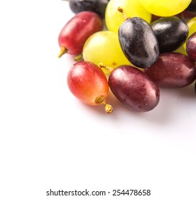 Red, Green And Black Grapes Fruits Over White Background