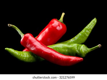 Red And Green Chili Pepper Isolated On Black