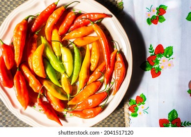 Red And Green Chilli Pepper On White Plate. Heritage Concept. Traditional Spice Of Mexican, Latin American And Hispanic Food. 