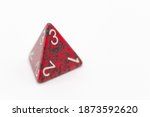 Red and green four-sided die displaying a 3