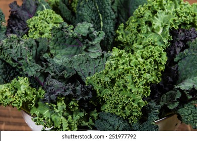Red and green kale leaves arranged