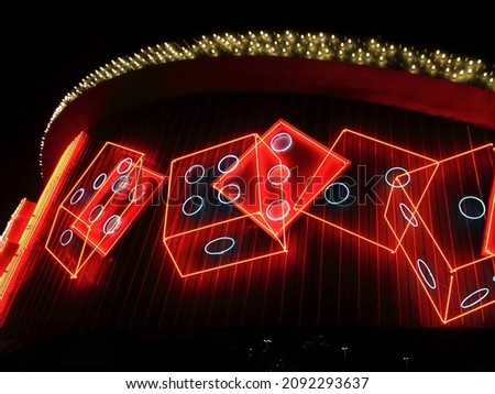 A red, green and yellow neon sign advertises gambling in Las Vegas