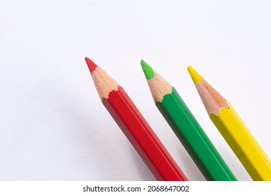 Red, green, yellow pencils as a symbol for government talks in germany on a white background with space for text, no person - Shutterstock ID 2068647002