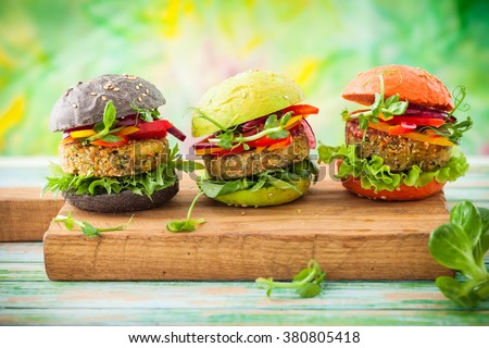 Red, green,black mini burgers with quinoa and vegetables 