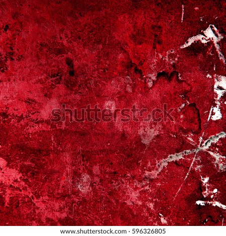 Red gift box and Christmas balls on wooden background.
