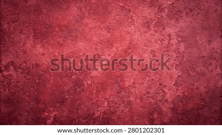 red grunge texture background featuring a cracked and weathered surface. The image showcases a distressed and aged aesthetic.