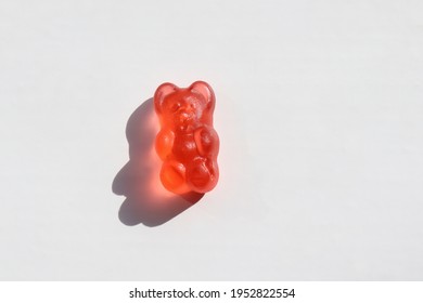 Red Gummy Bear Jelly Candy On White Background. Top View, Flat Lay, Copy Space. Pink Wine Gummy Bear