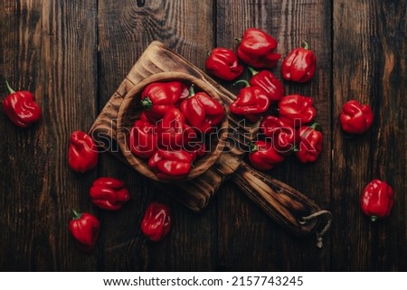 Red Habanero Peppers in a Wooden Bowl. View from Above