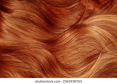 Red hair close-up as a background. Women's long orange hair. Beautifully styled wavy shiny curls. Hair coloring bright shades. Hairdressing procedures, extension. - Shutterstock ID 2365930763