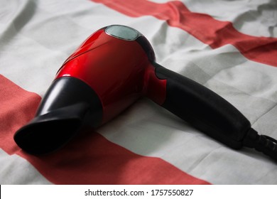 Red Hair Dryer On The Bed
