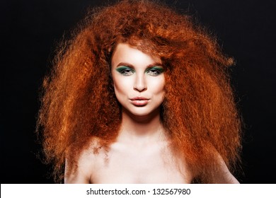 Red Hair. Fashion Girl Portrait. long Curly Hair. green evening make-up