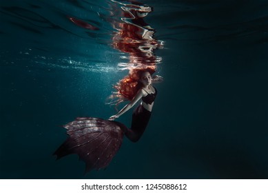 Red Hair Freediver Girl With Black Mermaid Tale