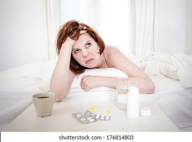 Red Hair Girl Hungover Wanting Coffee And Medication To Help With Her Hungover In Bed