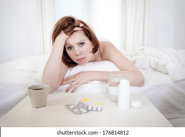 Red Hair Girl Hungover Wanting Coffee And Medication To Help With Her Hungover In Bed