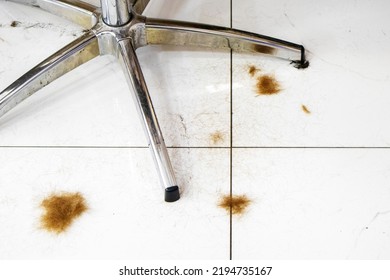 Red Hair On The Barber Shop Floor And Chair Legs