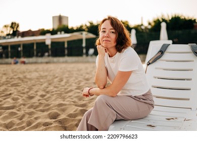 Red Hair Woman Close-up Fluttering In The Wind On The Beach In Summer Holidays, Rack Focus