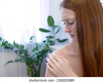 Red hair woman strokes and scratches sunburn skin on back and shoulders. Close-up view of back and shoulders with sunburn marks. Woman with reddened itchy skin. Concept of sunbathe without sunscreen. - Shutterstock ID 2182032889