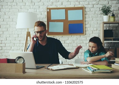 Red Haired Disgruntled Teen Girl Gets Angry With Father, Who Is Busy Doing Things. Fatherhood.